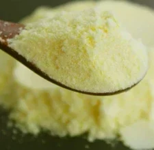 Apple cider vinegar powder on a spoon, the star ingredient in SugarControl gummies